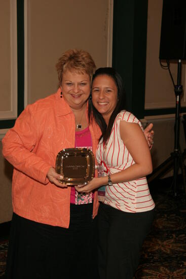 Kathy Williams and Unidentified With Award at Friday Convention Session Photograph 2, July 14, 2006 (image)