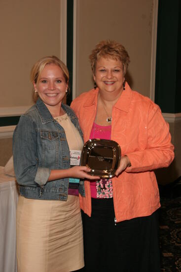 Kathy Williams and Kelsey Johnston With Award at Friday Convention Session Photograph, July 14, 2006 (image)