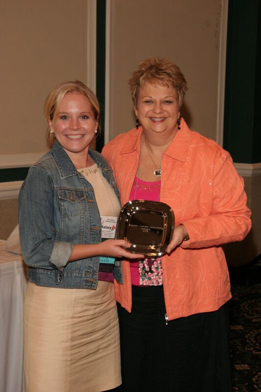 Kathy Williams and Kelsey Johnston With Award at Friday Convention Session Photograph, July 14, 2006 (Image)