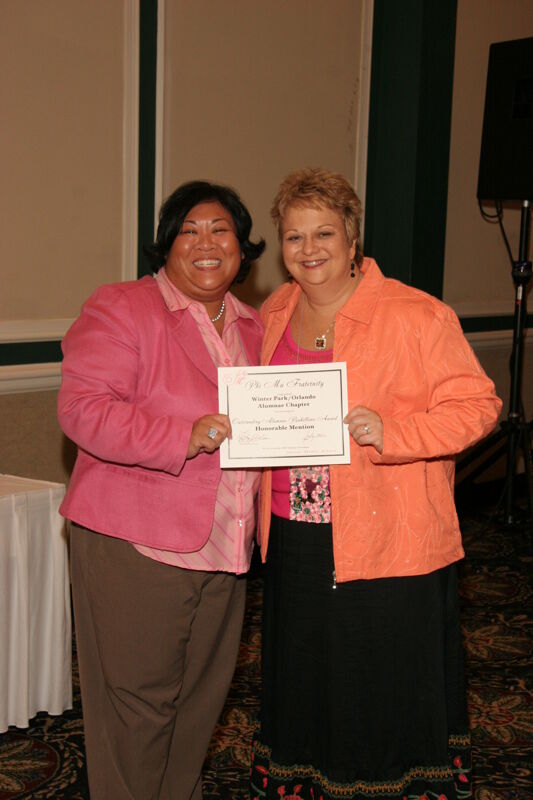 Kathy Williams and Winter Park Alumnae Chapter Member With Certificate at Friday Convention Session Photograph, July 14, 2006 (Image)