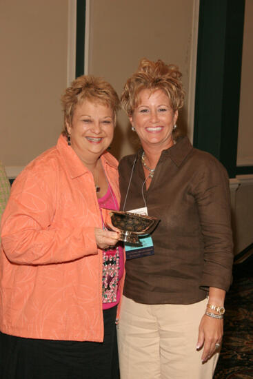 Kathy Williams and Sarah Conner With Award at Friday Convention Session Photograph, July 14, 2006 (image)