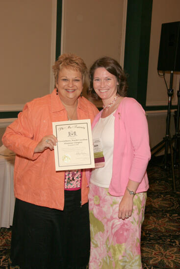 Kathy Williams and Greensboro Alumnae Chapter Member With Certificate at Friday Convention Session Photograph, July 14, 2006 (image)