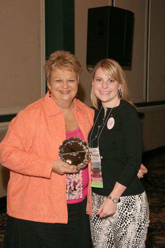 July 14 Kathy Williams and Shelly Favre With Award at Friday Convention Session Photograph Image