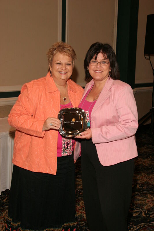 Kathy Williams and Unidentified With Award at Friday Convention Session Photograph 4, July 14, 2006 (Image)