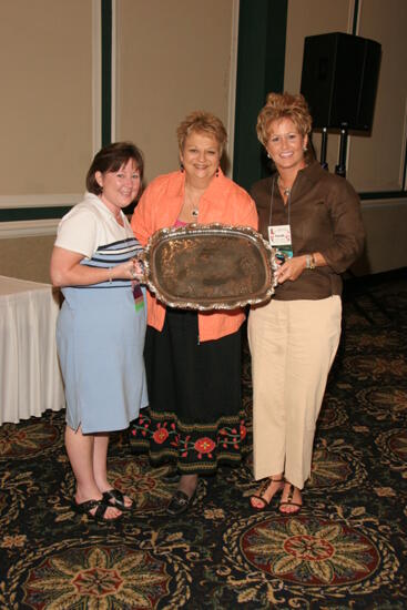 Benoit, Williams, and Conner With Award at Friday Convention Session Photograph 1, July 14, 2006 (image)