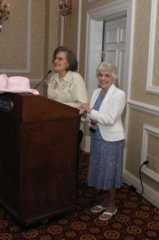 Joan Wallem Introducing Gloria Henson at 1852 Dinner Photograph, July 14, 2006 (Image)