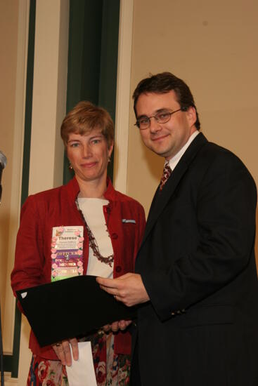 Therese DeMouy and Unidentified Man With Award at Thursday Convention Luncheon Photograph 1, July 2006 (image)