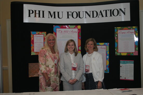 Unidentified, Jordan, and Logan by Foundation Exhibit at Convention Photograph 1, July 2006 (image)