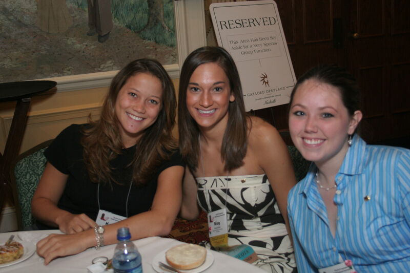 Meg Miller and Two Unidentified Phi Mus at Convention Breakfast Photograph 1, July 2006 (Image)