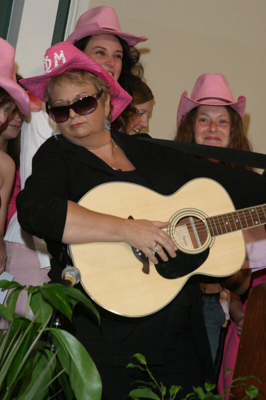 Kathy Williams Playing Guitar at Convention Photograph 1, July 2006 (Image)