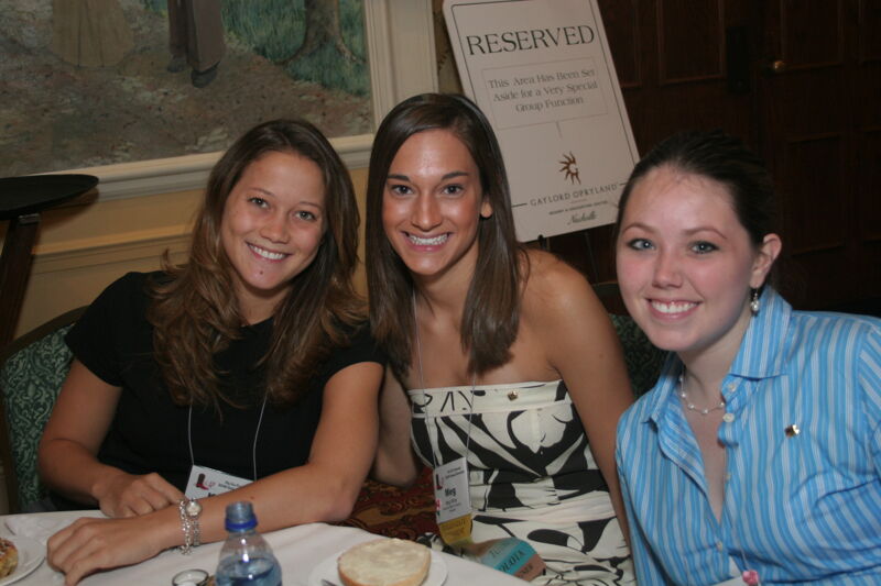 Meg Miller and Two Unidentified Phi Mus at Convention Breakfast Photograph 2, July 2006 (Image)