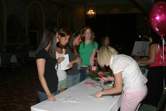 Four Phi Mus at Convention Registration Table Photograph, July 2006 (image)