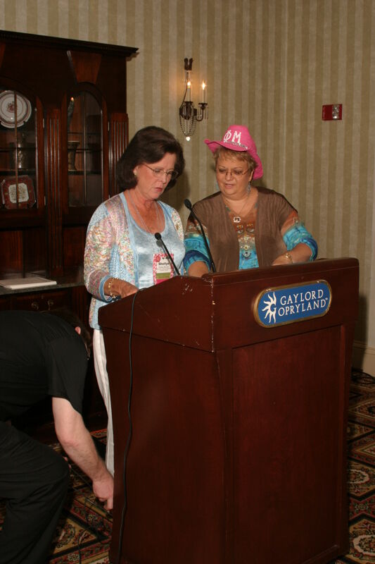 Shellye McCarty and Kathy Williams at Podium During Convention Officer Luncheon Photograph, July 2006 (Image)