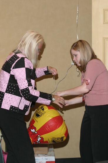 Two Phi Mus Assembling CMN Balloon at Convention Photograph 1, July 2006 (image)