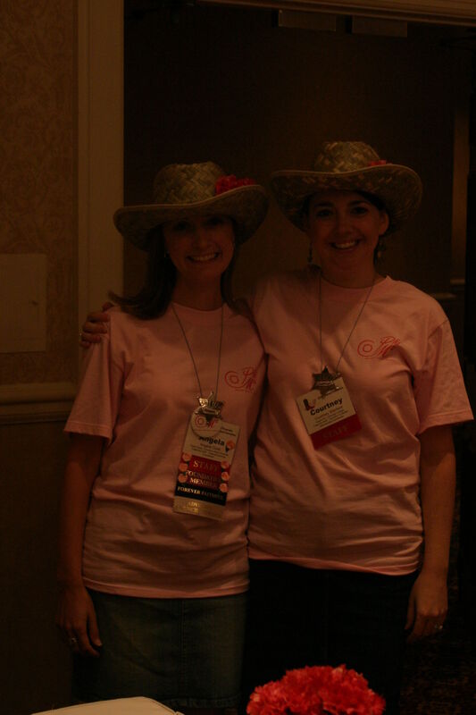 Angela Cook and Courtney Stanford in Hats at Convention Registration Photograph 1, July 2006 (Image)