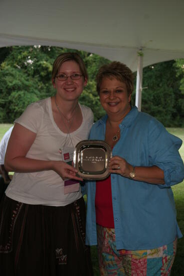 Kathy Williams and Unidentified With Award at Convention Outdoor Luncheon Photograph 2, July 2006 (image)