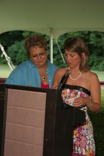 Kathy Williams and Melissa Walsh at Podium During Convention Outdoor Luncheon Photograph, July 2006 (image)