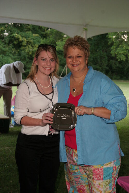 Kathy Williams and Unidentified With Award at Convention Outdoor Luncheon Photograph 1, July 2006 (Image)
