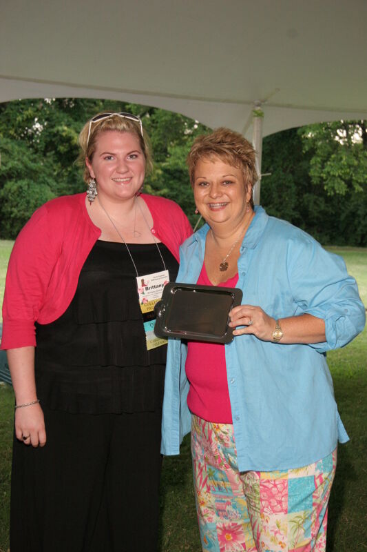 July 2006 Kathy Williams and Brittany Sibiski With Award at Convention Outdoor Luncheon Photograph Image