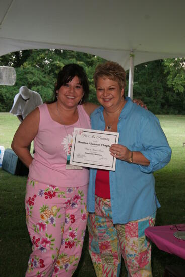 Kathy Williams and Houston Alumnae Chapter Member With Certificate at Convention Outdoor Luncheon Photograph, July 2006 (image)