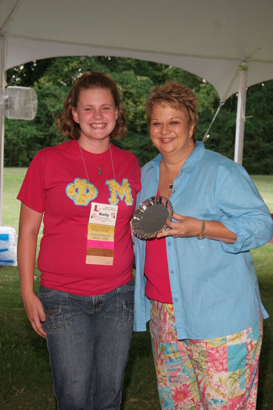 July 2006 Kathy Williams and Kelly Prather With Award at Convention Outdoor Luncheon Photograph Image