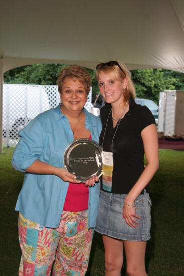 Kathy Williams and Amy Hayes With Award at Convention Outdoor Luncheon Photograph, July 2006 (image)