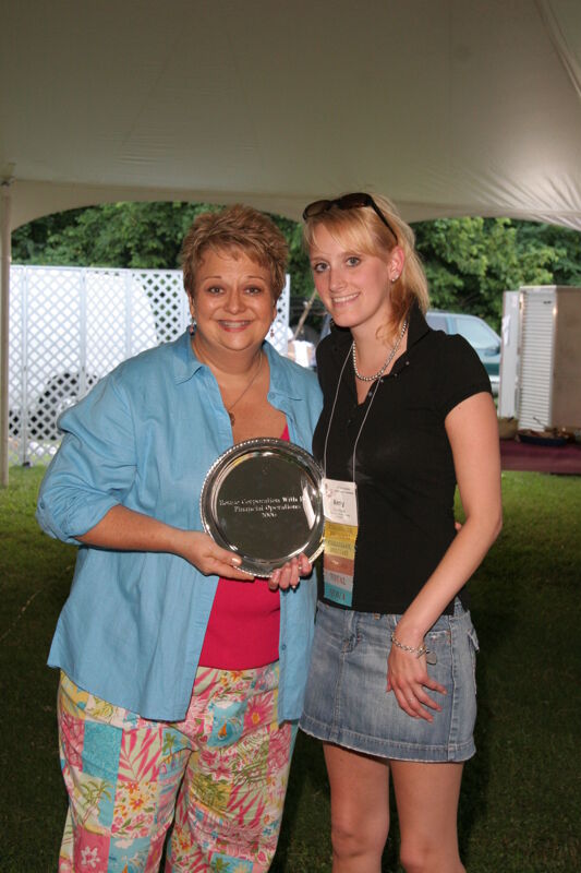 Kathy Williams and Amy Hayes With Award at Convention Outdoor Luncheon Photograph, July 2006 (Image)