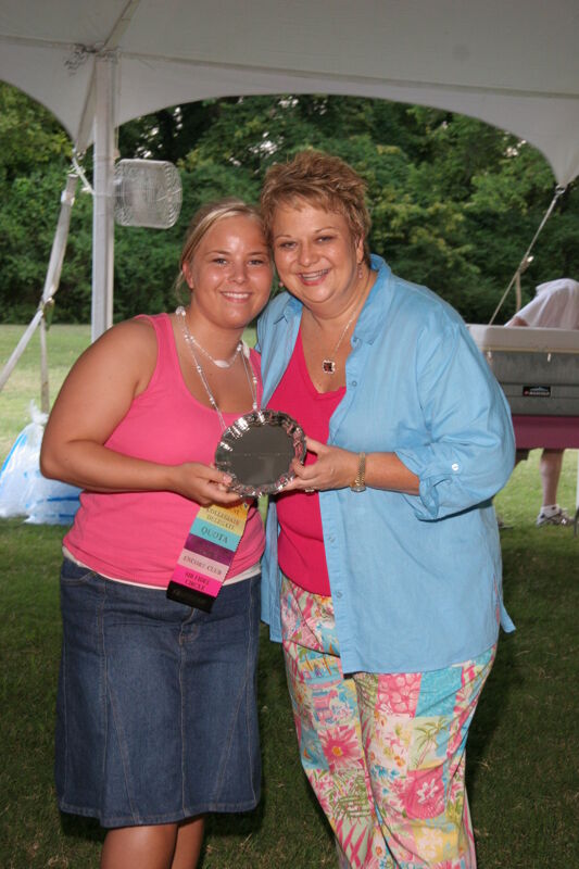 Kathy Williams and Unidentified With Award at Convention Outdoor Luncheon Photograph 3, July 2006 (Image)