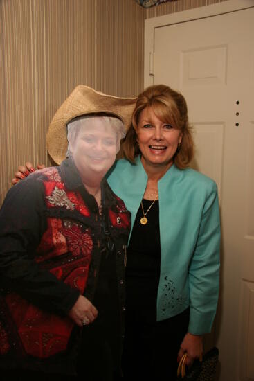 Peggy King With Cardboard Image of Kathy Williams at Convention Officer Reception Photograph, July 2006 (image)