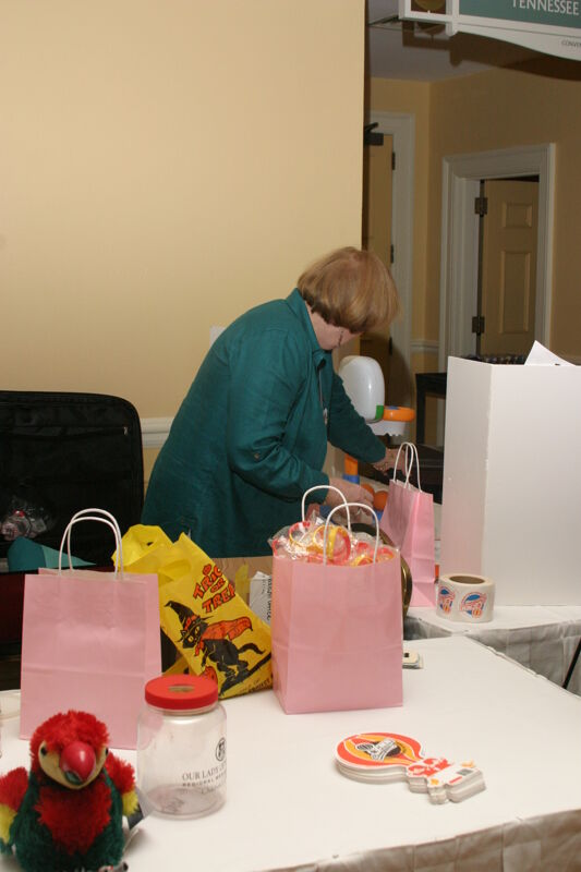 Dusty Manson Setting Up Convention Display Photograph, July 2006 (Image)