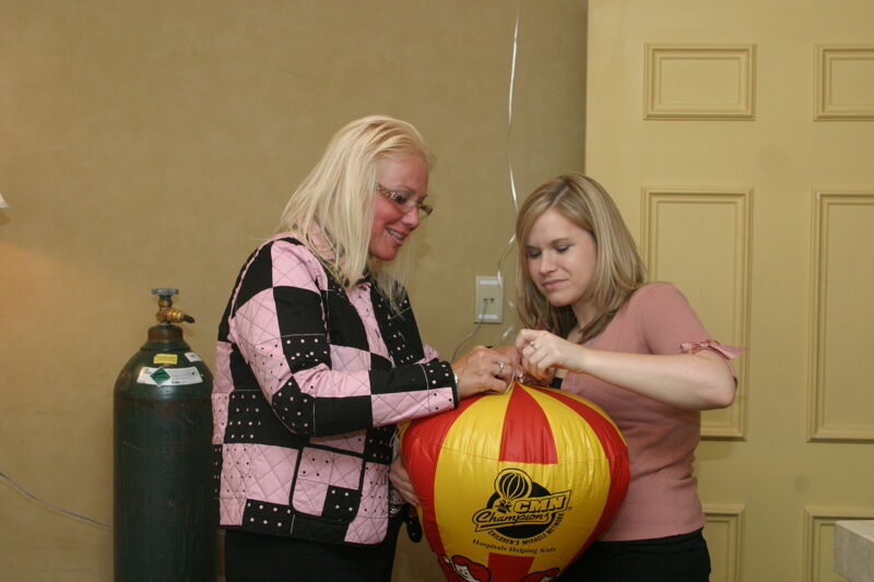 Two Phi Mus Assembling CMN Balloon at Convention Photograph 2, July 2006 (Image)