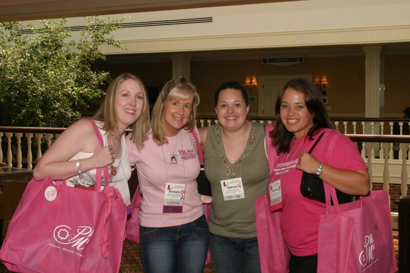 Montemayor, Cleveland, and Two Unidentified Phi Mus at Convention Registration Photograph 1, July 2006 (Image)