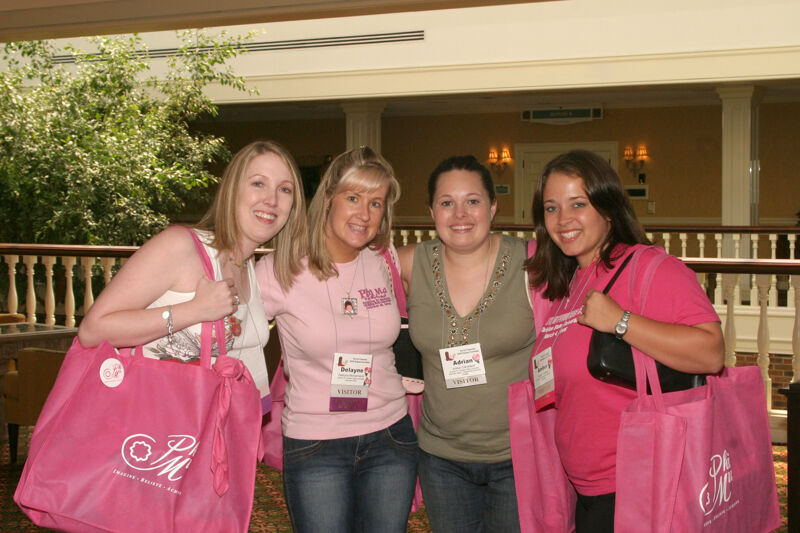 Montemayor, Cleveland, and Two Unidentified Phi Mus at Convention Registration Photograph 2, July 2006 (Image)
