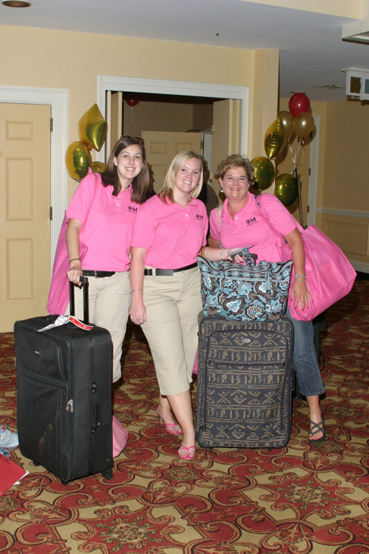 Three Phi Mus With Luggage at Convention Registration Photograph, July 2006 (Image)