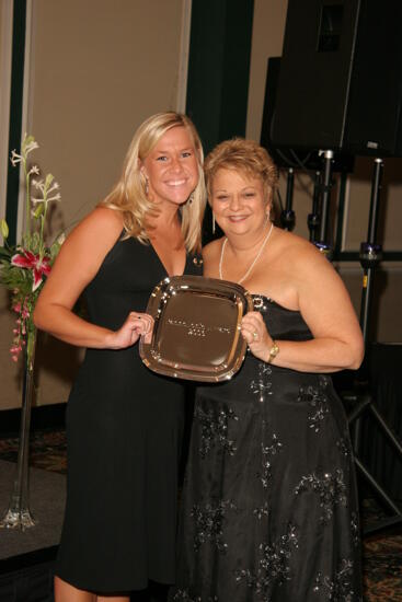 Kathy Williams and Unidentified With Award at Convention Carnation Banquet Photograph 11, July 15, 2006 (image)