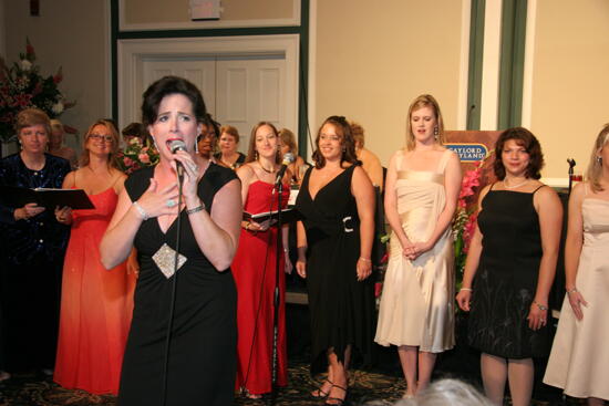 Mary Helen Griffis Singing at Convention Carnation Banquet Photograph 3, July 15, 2006 (image)