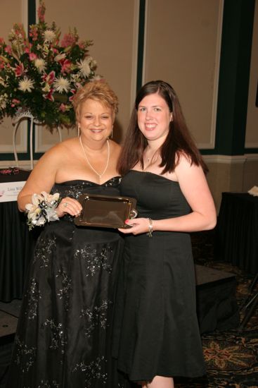 Kathy Williams and Unidentified With Award at Convention Carnation Banquet Photograph 9, July 15, 2006 (image)