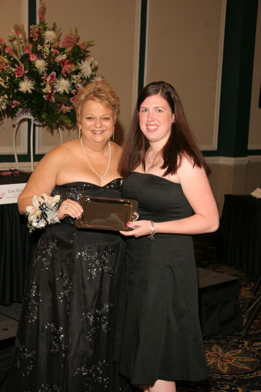 Kathy Williams and Unidentified With Award at Convention Carnation Banquet Photograph 9, July 15, 2006 (Image)