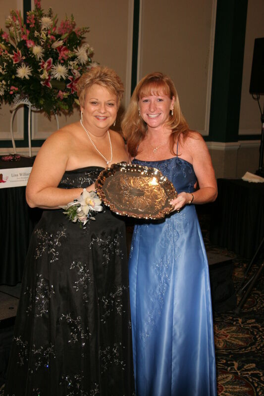Kathy Williams and Unidentified With Award at Convention Carnation Banquet Photograph 6, July 15, 2006 (Image)
