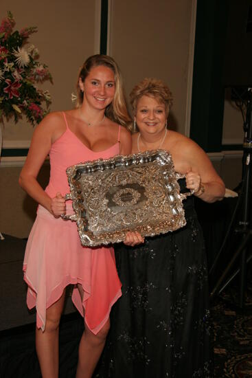 Kathy Williams and Gamma Tau Chapter Member With Award at Convention Carnation Banquet Photograph 1, July 15, 2006 (image)