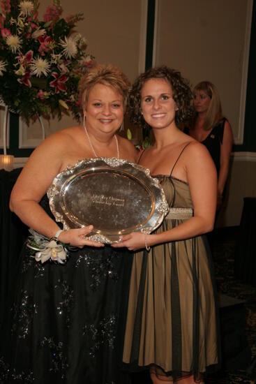 Kathy Williams and Unidentified With Award at Convention Carnation Banquet Photograph 3, July 15, 2006 (image)