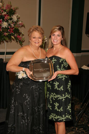 Kathy Williams and Unidentified With Award at Convention Carnation Banquet Photograph 12, July 15, 2006 (image)