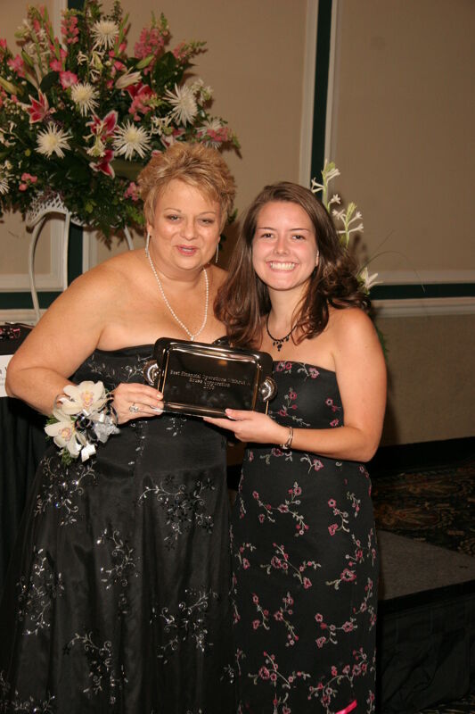 Kathy Williams and Unidentified With Award at Convention Carnation Banquet Photograph 10, July 15, 2006 (Image)