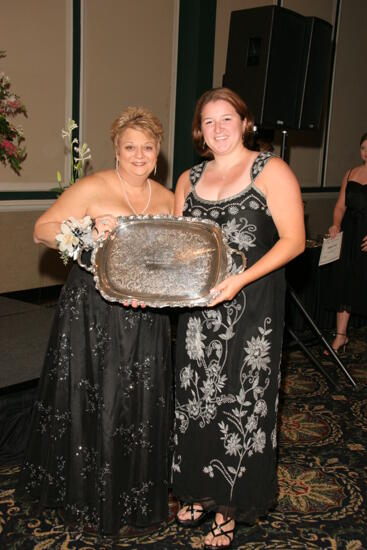 Kathy Williams and Unidentified With Award at Convention Carnation Banquet Photograph 1, July 15, 2006 (image)