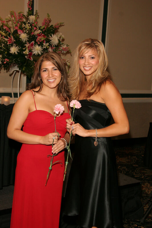 Two Unidentified Phi Mus With Flowers at Convention Carnation Banquet Photograph 1, July 15, 2006 (Image)