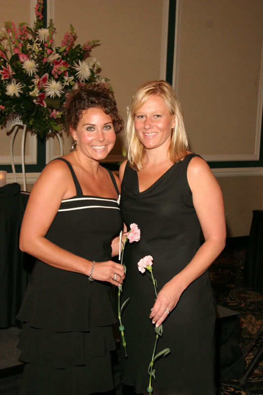 Two Unidentified Phi Mus With Flowers at Convention Carnation Banquet Photograph 2, July 15, 2006 (Image)