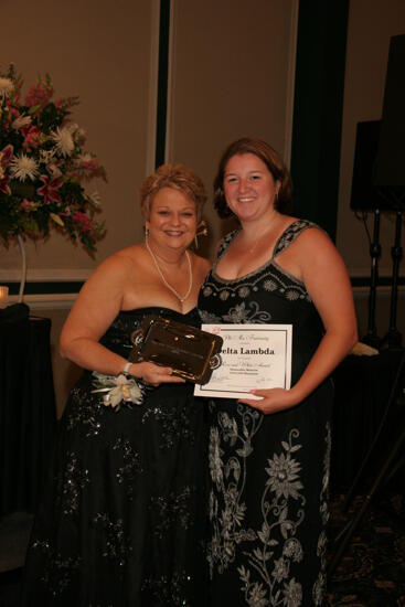 Kathy Williams and Delta Lambda Chapter Member With Award at Convention Carnation Banquet Photograph, July 15, 2006 (image)