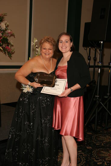 Kathy Williams and Unidentified With Award at Convention Carnation Banquet Photograph 13, July 15, 2006 (image)