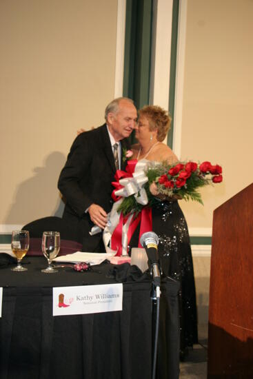 Kathy Williams Receiving Flowers at Convention Carnation Banquet Photograph 1, July 15, 2006 (image)