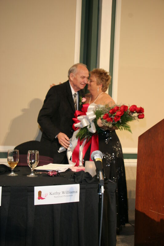Kathy Williams Receiving Flowers at Convention Carnation Banquet Photograph 1, July 15, 2006 (Image)